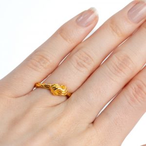 Justerbar ring vriden knut koppar guldfärgad